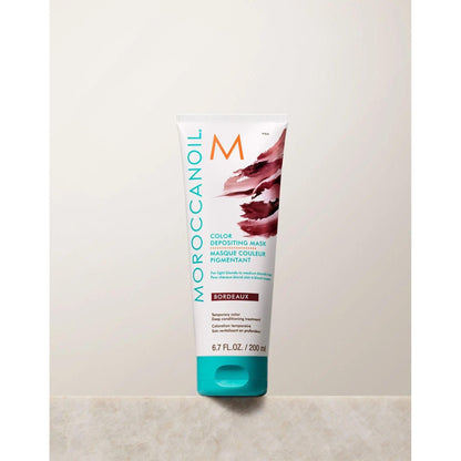 Moroccanoil Color Depositing Mask in Bordeaux, 200ml for rejuvenating and enhancing hair color.