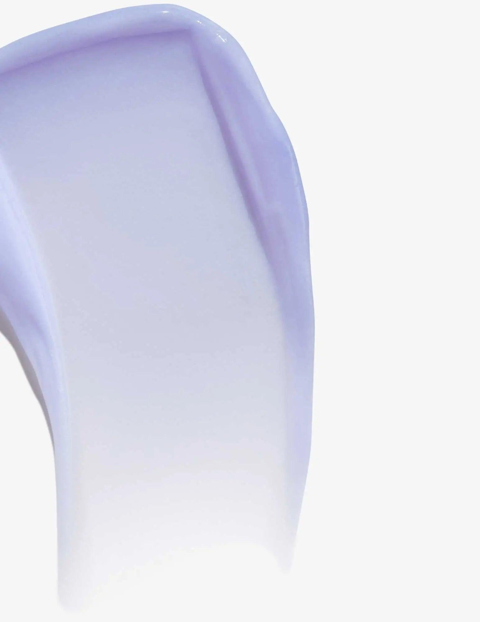 Smooth application of purple Redken Color Extend Blondage Conditioner for blonde and highlighted hair.