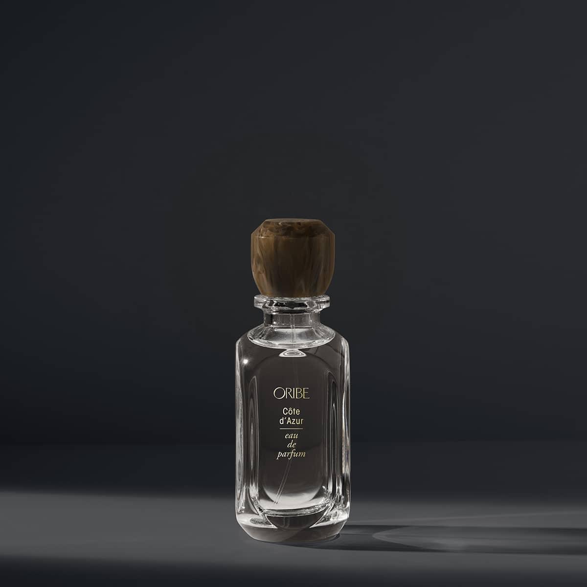 Luxury Oribe Côte d'Azur eau de parfum bottle against dark background