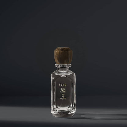 Luxury Oribe Côte d'Azur eau de parfum bottle against dark background