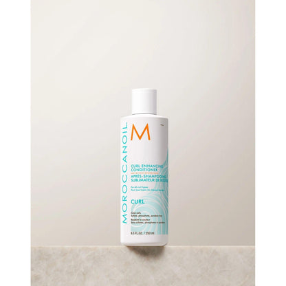 Moroccanoil Curl Enhancing Conditioner bottle on a light background, designed to nourish and define curls.