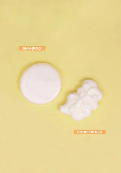 Curl shampoo and conditioner swatches on a yellow background, showcasing nourishing formulas for waves and curls.