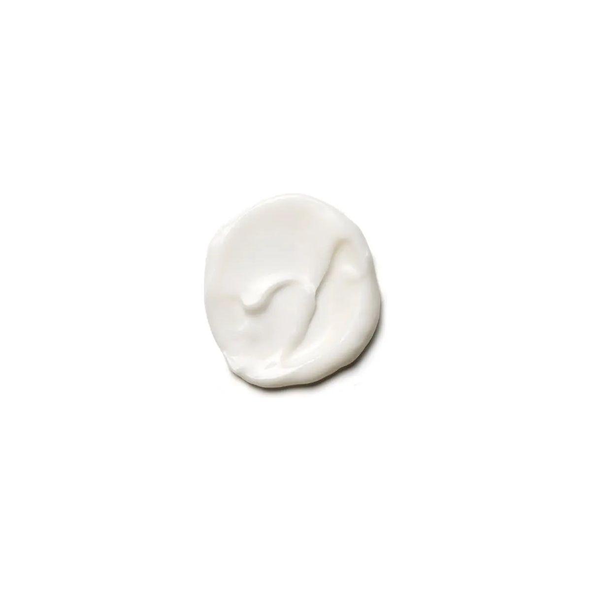 Creamy white texture of Moroccanoil Extra Volume Conditioner for fine, limp hair.