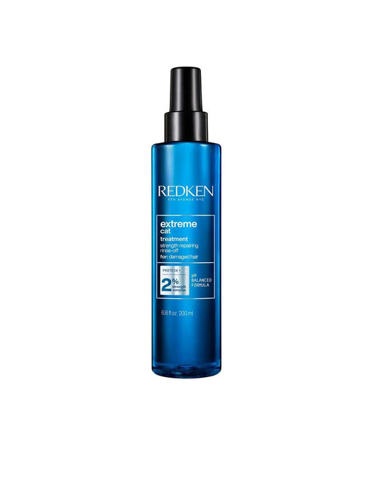 Redken Extreme Cat Treatment spray bottle for strengthening distressed hair, suitable for all hair types and textures.