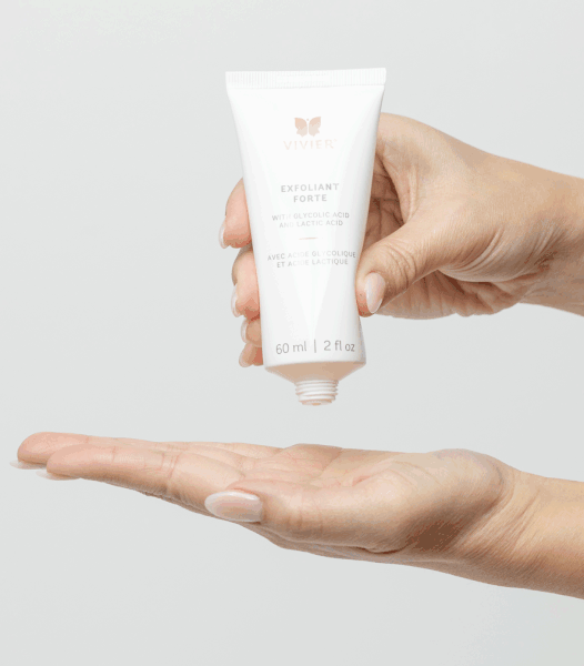 Vivier Exfoliant Forte lotion in hand, featuring glycolic and lactic acids for smoother, brighter skin.