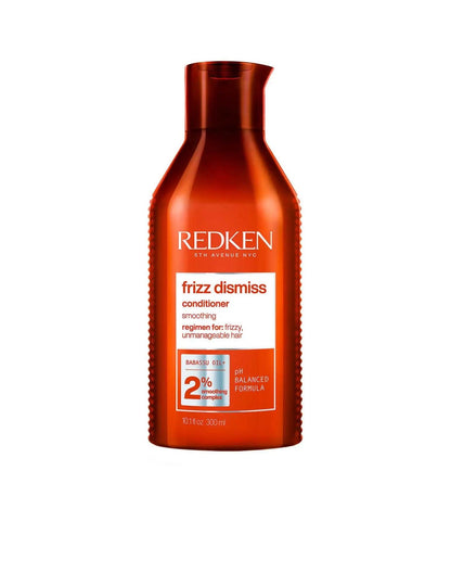 Redken Frizz Dismiss Conditioner bottle, 11 oz, designed to smooth frizzy hair and improve manageability for all hair types.