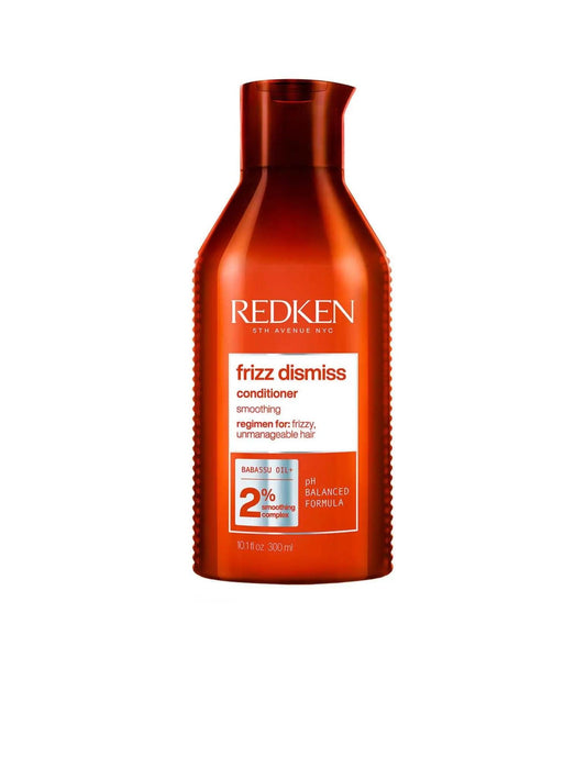 Redken Frizz Dismiss Conditioner bottle, 11 oz, designed to smooth frizzy hair and improve manageability for all hair types.