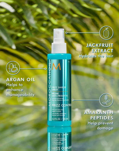 Frizz Shield Spray with argan oil, jackfruit extract, and amaranth peptides for humidity control and shine.