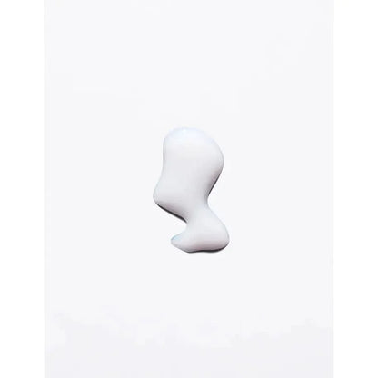 Skincare cream or lotion drop on white background, showcasing texture and consistency.