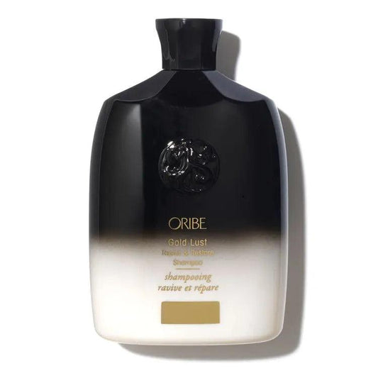 Oribe Gold Lust Repair & Restore Shampoo Bottle for luxurious hair care and revitalization
