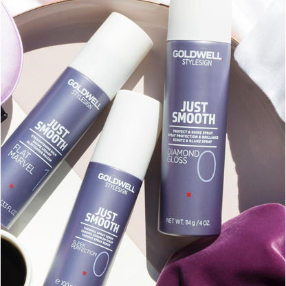 Goldwell Just Smooth hair care products, including Sleek Perfection and Diamond Gloss, arranged on a stylish background.