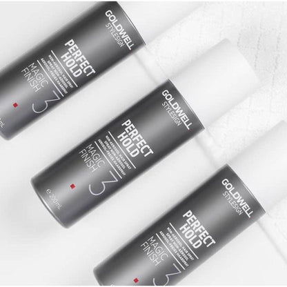 Three Goldwell Perfect Hold Magic Finish Hairspray bottles showcasing light to medium hold and shine.