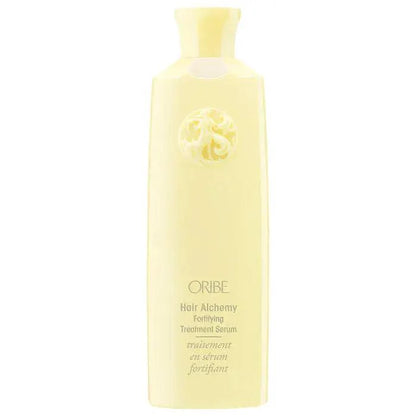 ORIBE Hair Alchemy Fortifying Treatment Serum in a sleek yellow bottle, designed to strengthen and protect hair.