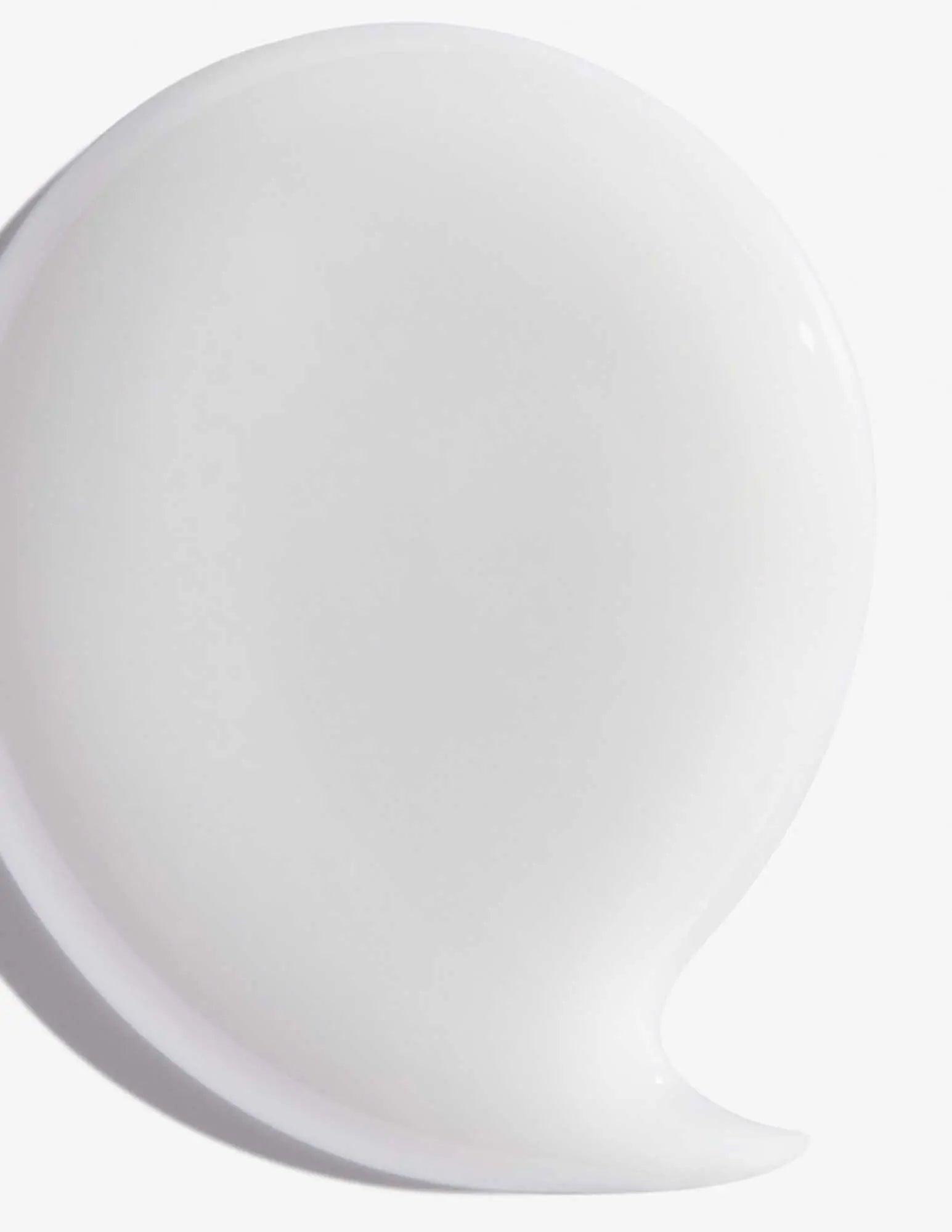 White creamy texture of Redken Hair Cleansing Cream Shampoo for effective hair cleansing and revitalization.
