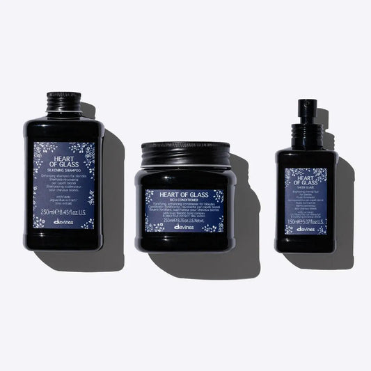 Davines Heart of Glass hair care set including shampoo, conditioner, and glaze for silky and radiant hair.