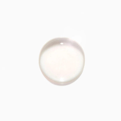Clear liquid drop on white background.
