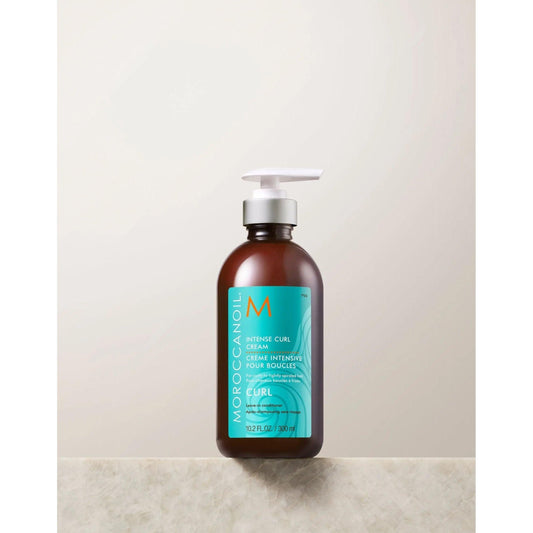 Moroccanoil Intense Curl Cream bottle on a neutral background, perfect for defining and moisturizing curls.