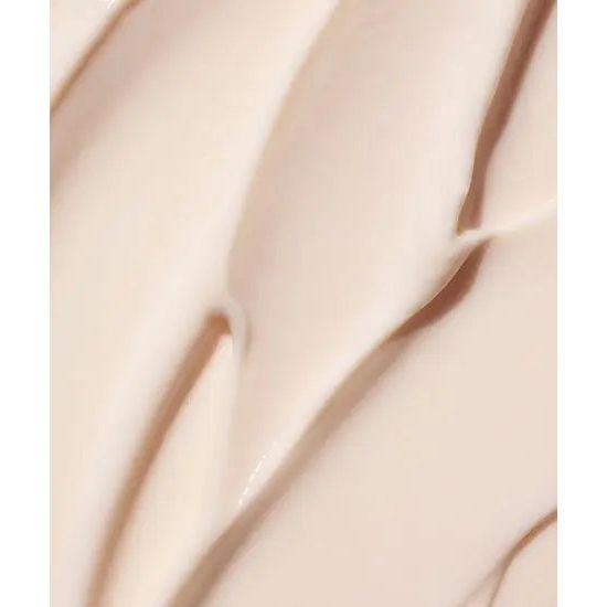 Close-up texture of creamy product, showcasing smooth and rich consistency ideal for moisturizing curls and waves.
