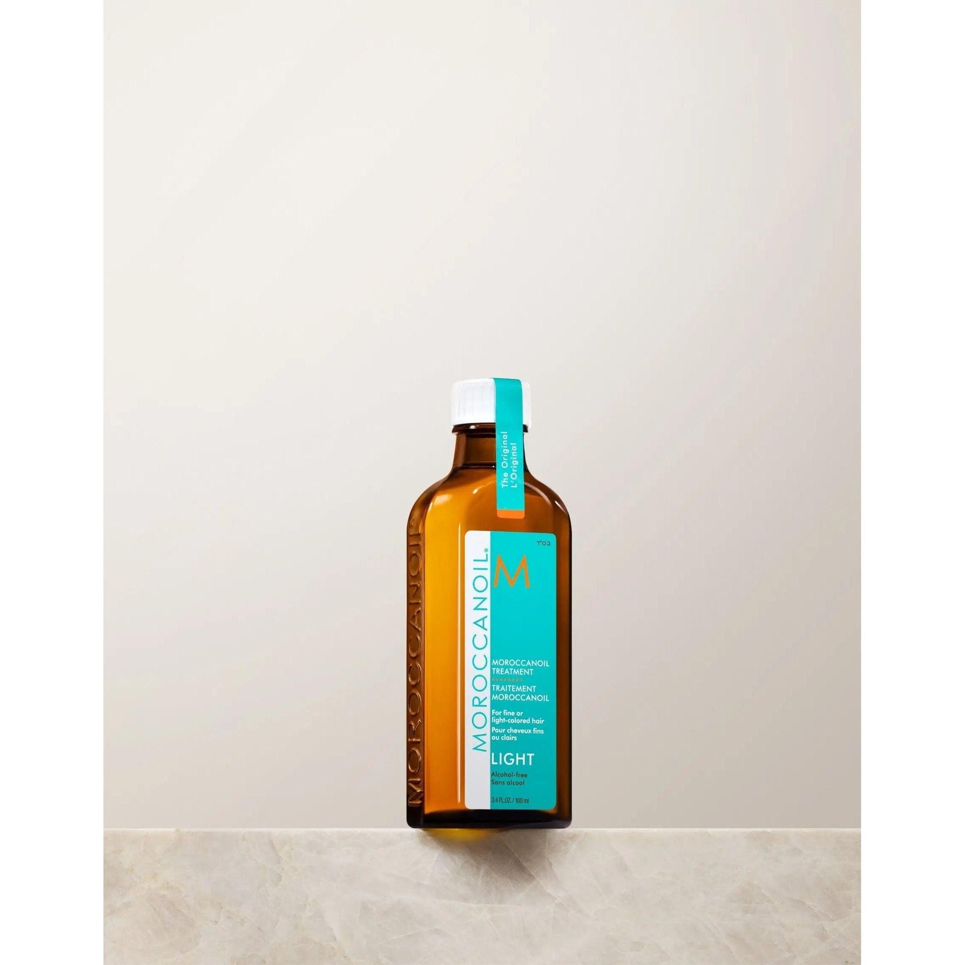 Moroccanoil Light Treatment bottle, a lightweight argan oil hair product for frizz control and shine.