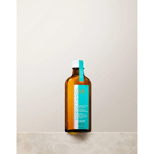 Moroccanoil Light Treatment bottle, a lightweight argan oil hair product for frizz control and shine.