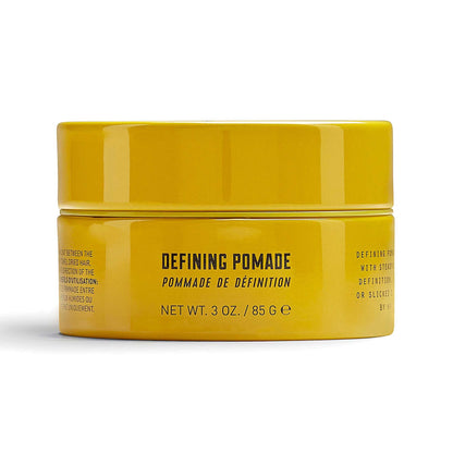 Lock Stock & Barrel Defining Pomade in a yellow jar, 85g, offers high shine and steadfast hold for sleek hairstyles.
