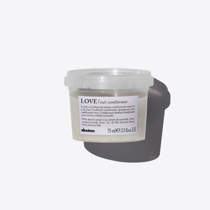 Davines LOVE curl conditioner for curly hair, 75 ml. This nourishing conditioner enhances curls and controls frizz for soft, defined locks.