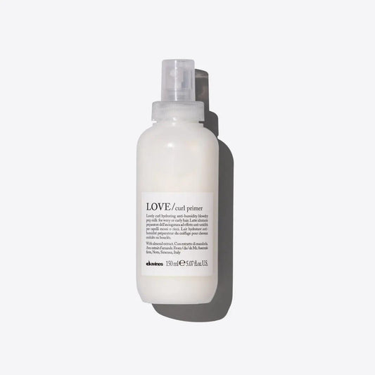 LOVE curl primer spray for hair, 150ml bottle on white background.