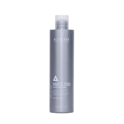 Hasty Too Love Me Curl modeling fluid for soft curl definition and long-lasting hold in a sleek silver bottle.