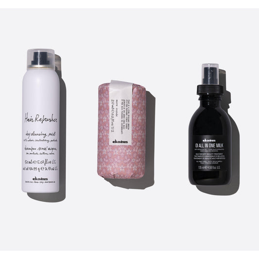 Low-maintenance textured hair set featuring Hair Refresher, Curl Building Serum, and OI All In One Milk for quick styling.