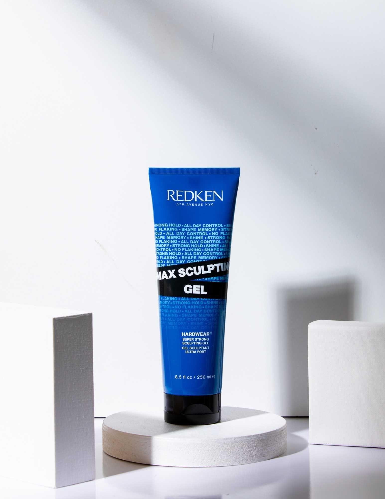 Redken Max Sculpting Gel in a blue tube on display, designed for maximum hold and control for all hair types.
