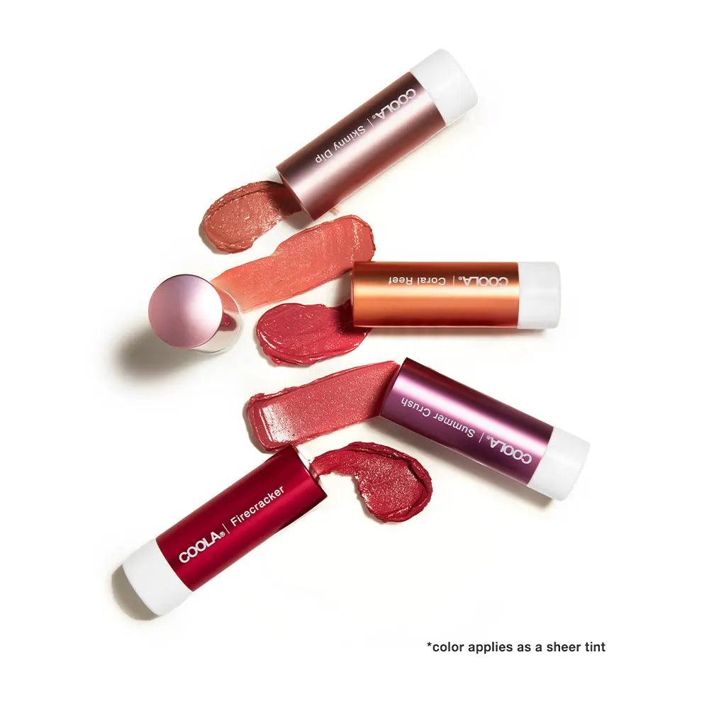 Coola Mineral Liplux tinted lip balms with swatches in shades, showcasing SPF 30 protection and organic ingredients.