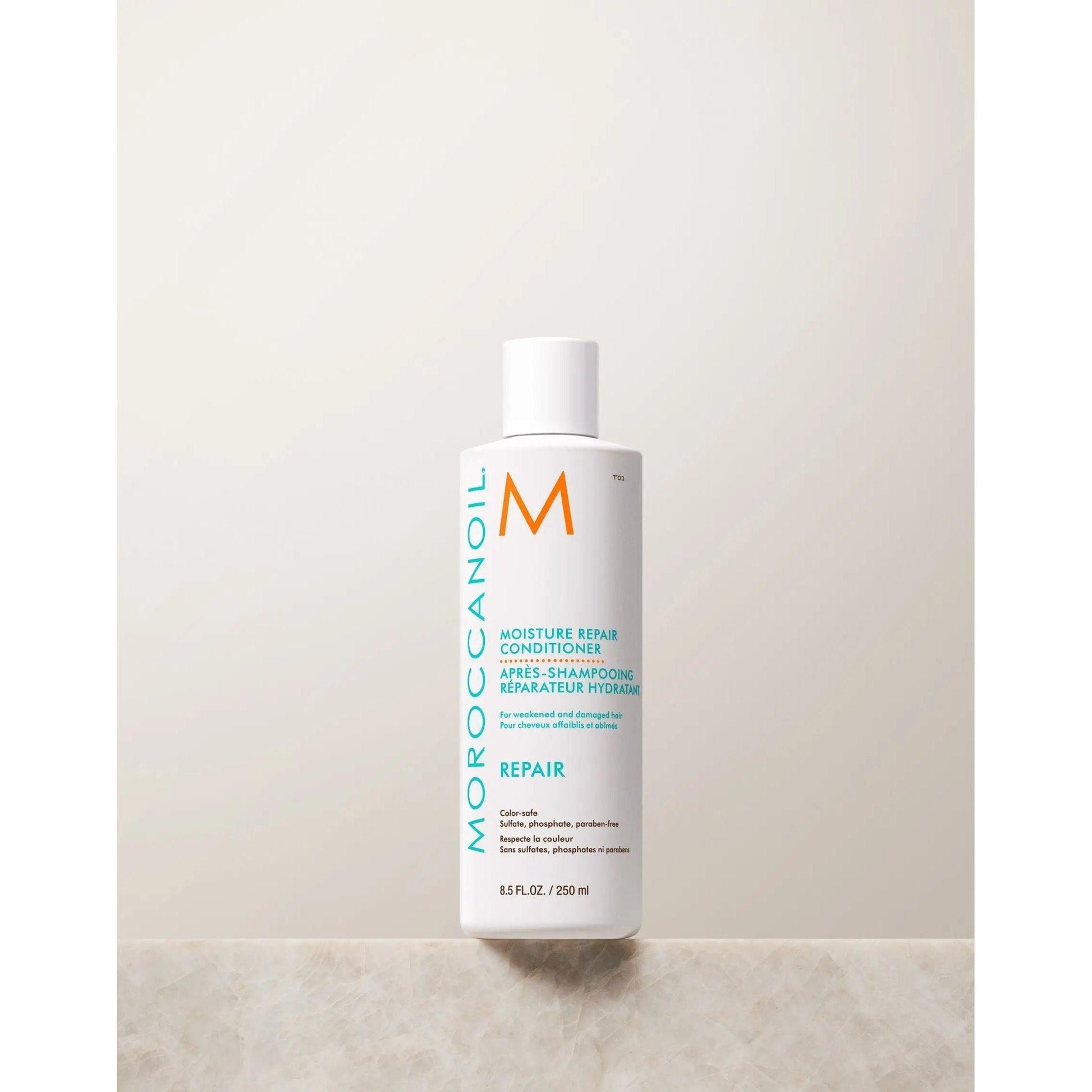 Moroccanoil Moisture Repair Conditioner bottle on a light background, designed to restore and hydrate damaged hair.