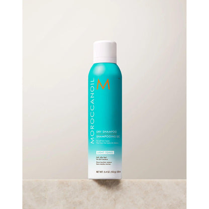 Moroccanoil Dry Shampoo Light Tones, 5.4 oz bottle, oil-absorbing formula for light hair shades, controls brassiness and odor.