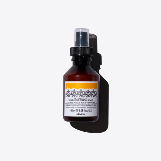 Naturaltech Nourishing Keratin Sealer in a spray bottle, designed to strengthen hair and prevent split ends with natural ingredients.