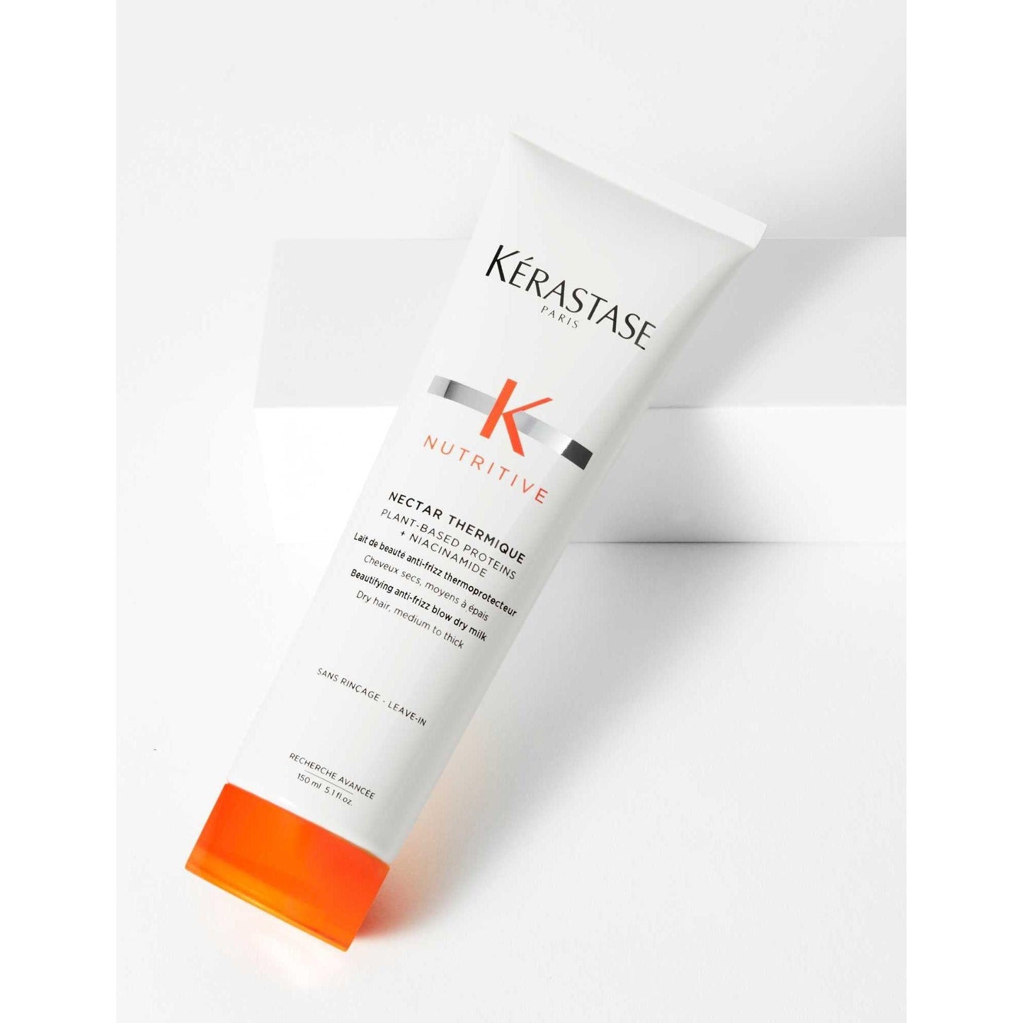 Kérastase Nectar Thermique anti-frizz blow-dry milk for medium to thick dry hair, nourishing heat protectant.