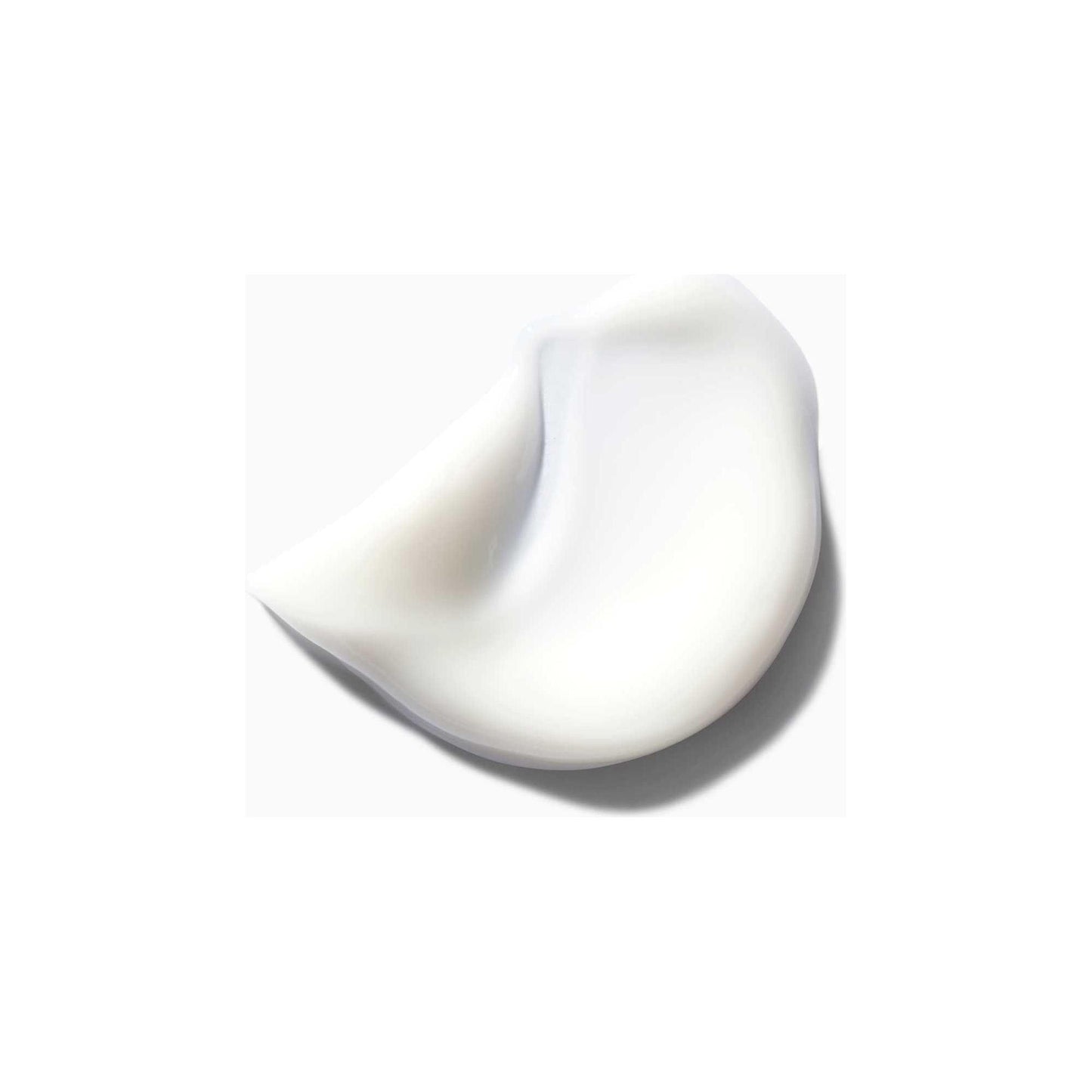 Creamy texture of Kérastase Nectar Thermique, an anti-frizz blow-dry milk for medium to thick dry hair.