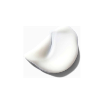 Creamy texture of Kérastase Nectar Thermique, an anti-frizz blow-dry milk for medium to thick dry hair.