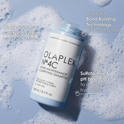 Olaplex No. 4C Bond Maintenance Clarifying Shampoo bottle in bubbles, designed for all hair types, sulfate-free for healthy hair.