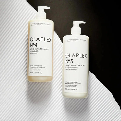 Olaplex No.4 Bond Maintenance Shampoo and No.5 Conditioner duo for repairing and strengthening all hair types.