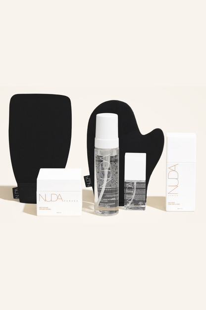 Deluxe Routine Kit featuring Self Tanning Mousse, Exfoliating Mitt, and Body Cream for a customizable tan.