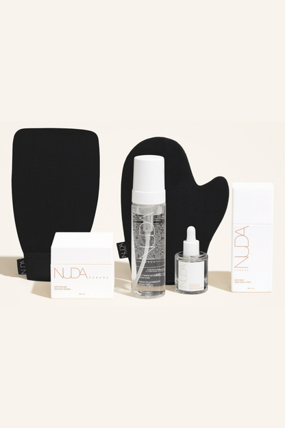 Deluxe Routine Kit featuring exfoliating mitt, self tanning mousse, face tanner, and body cream for a customizable glow.