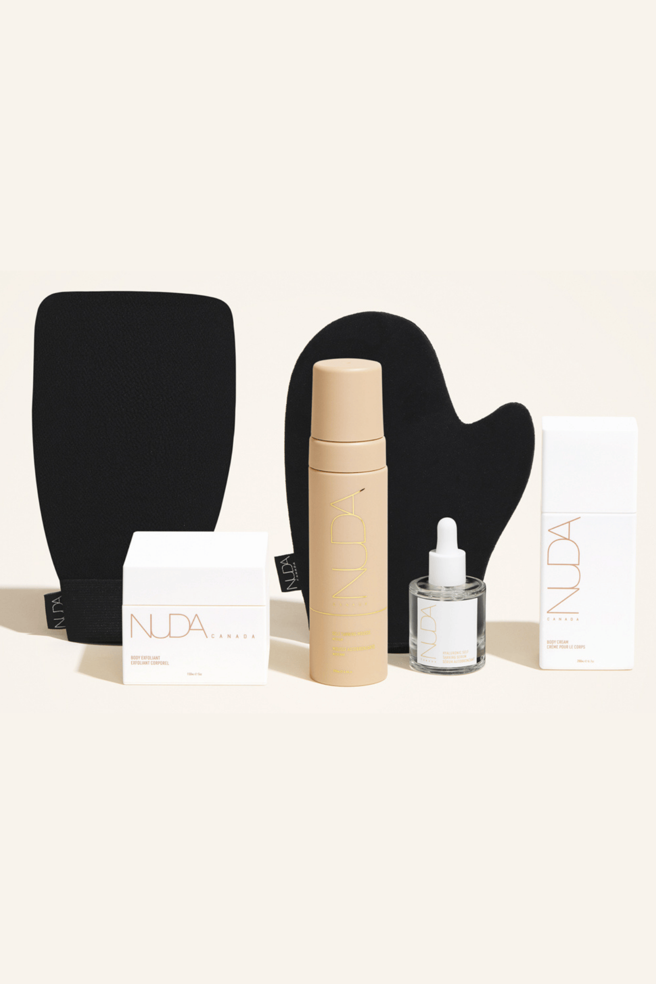 Deluxe Routine Kit featuring self tanning mousse, exfoliating mitt, face tanner, and body cream for a flawless tan.