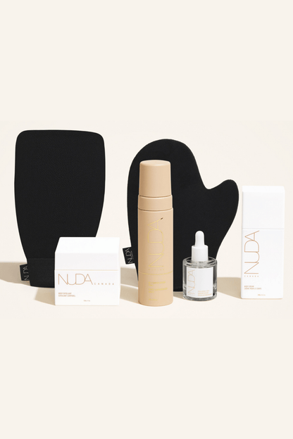 Deluxe Routine Kit featuring self tanning mousse, exfoliating mitt, face tanner, and body cream for a flawless tan.
