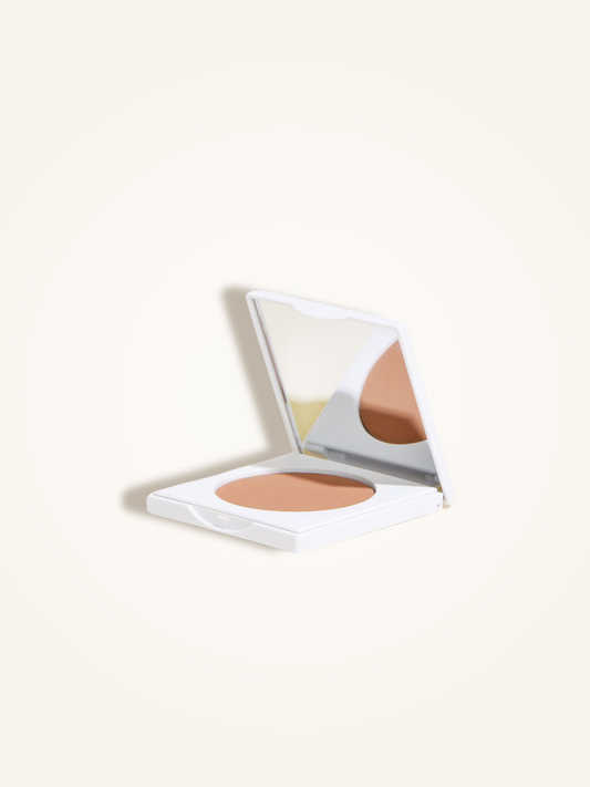 Matte bronzing powder in a compact, featuring a mirror for easy application and a natural tan finish.