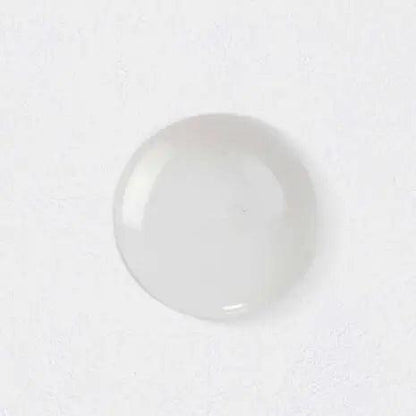 clear gel drop from Kérastase Nutritive Bain Satin 2 refill pouch on a white background