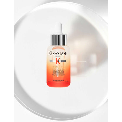 Kérastase Nutritive Nutri-Supplement Split-Ends Serum in a sleek bottle on a minimal white background.