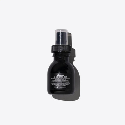 Black hair care product bottle against white background
