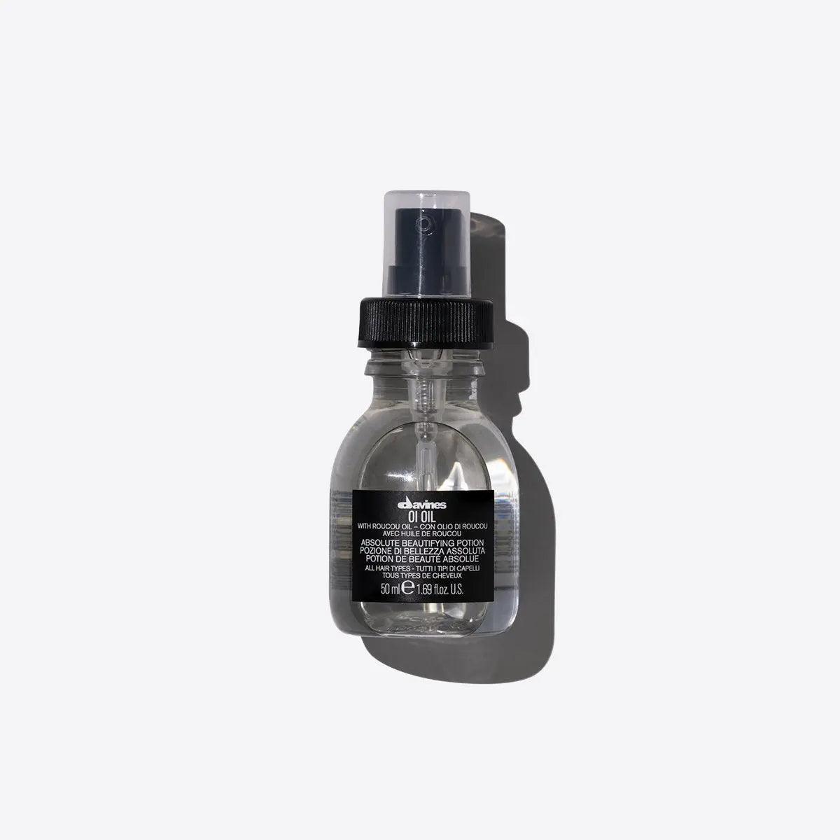 Hair product bottle with black label on a gray background