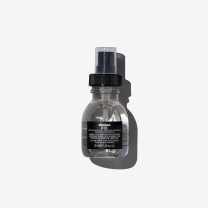 Hair product bottle with black label on a gray background