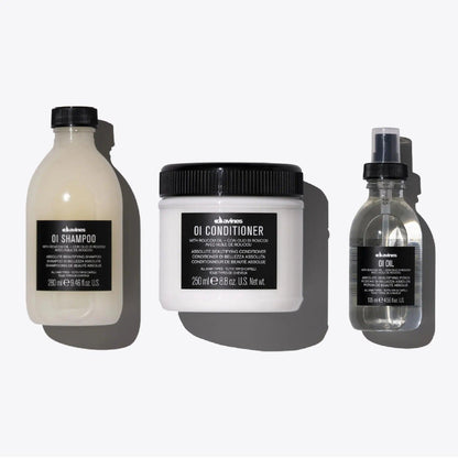 OI Set featuring OI Shampoo, OI Conditioner, and OI Oil for shiny, fragrant hair suitable for all hair types.